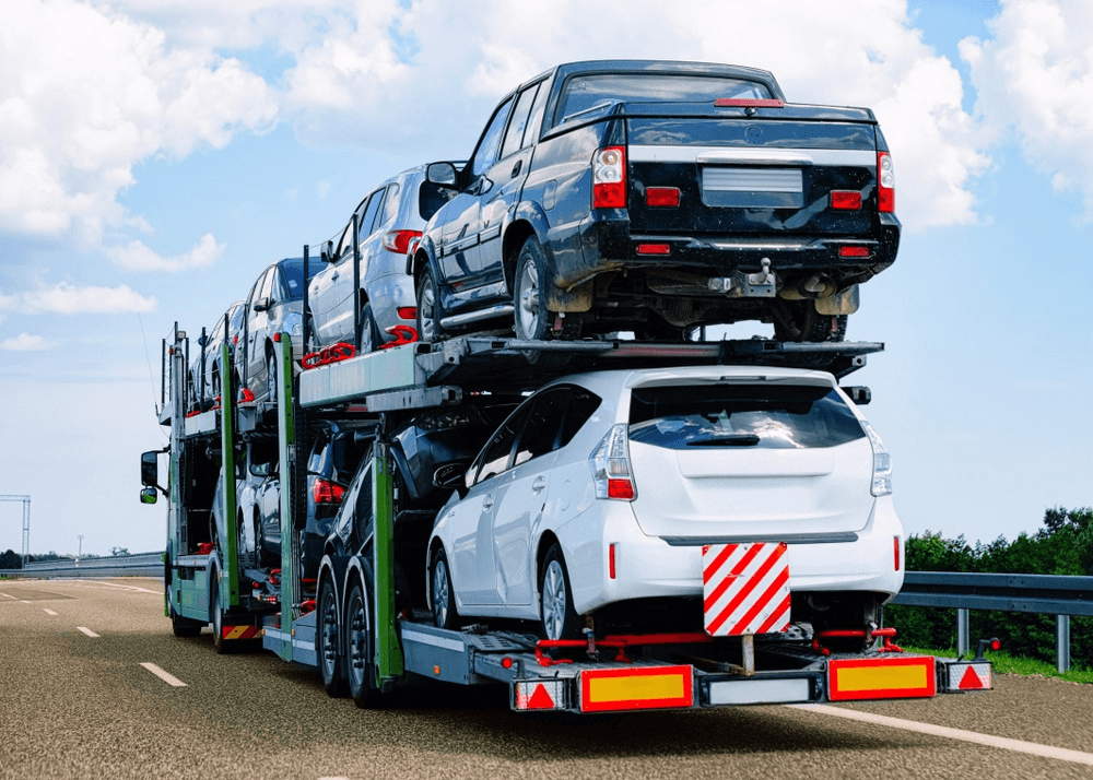 Vehicles on a carrier ready for onward shipping